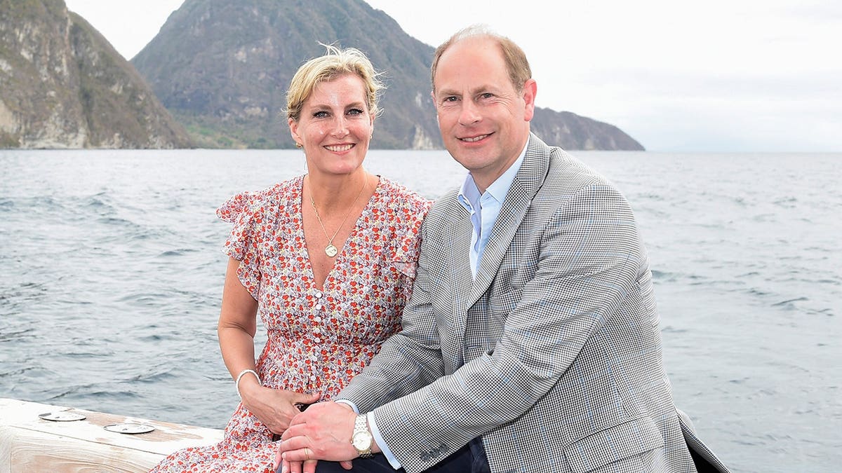Prince Edward and Sophie, Countess of Wessex, depart by boat in Soufriere.