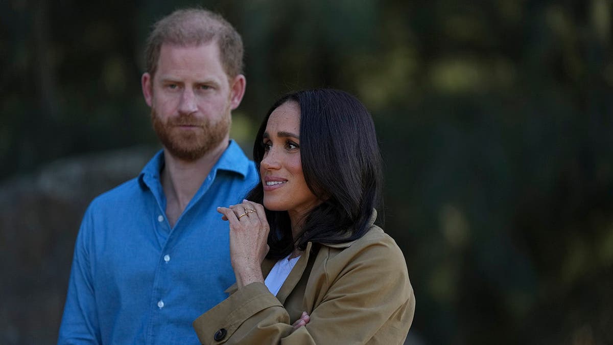 Prince Harry and Meghan, Duchess of Sussex, walk during a Scar Tree Walk in Melbourne.