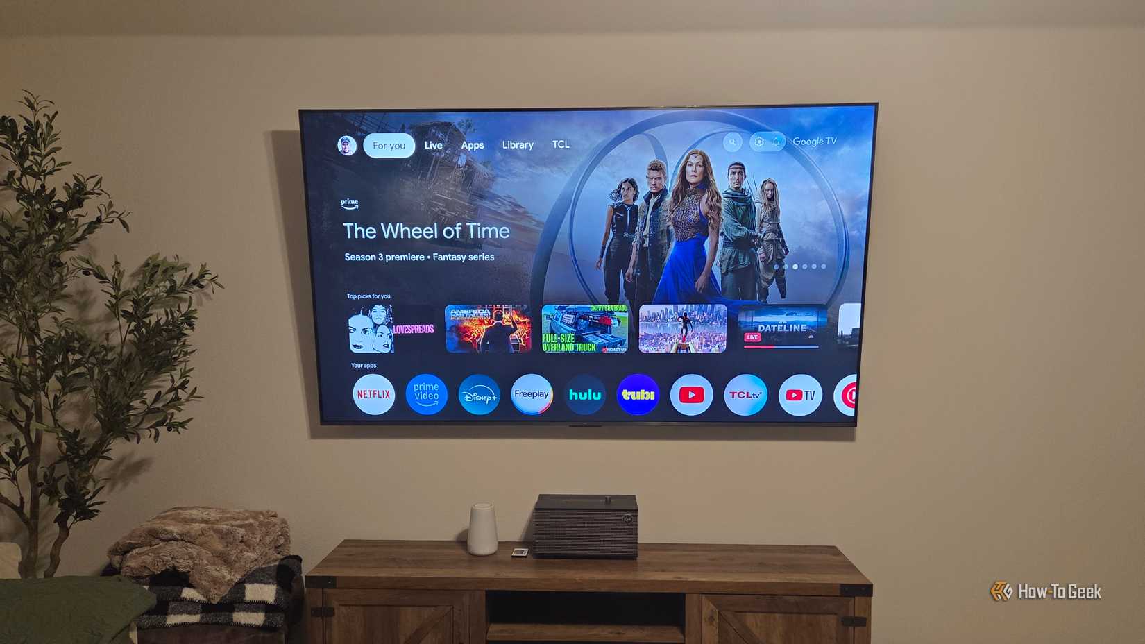 TCL QM6K Showing Google TV homescreen.