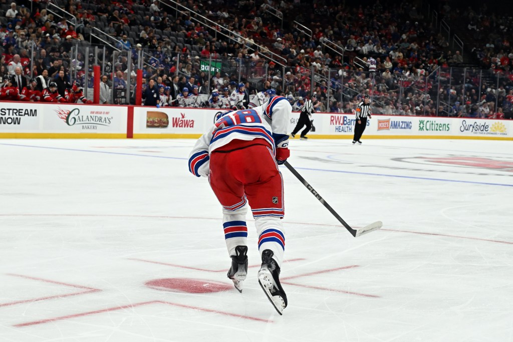 Rangers' Adam Sykora (38) skates back to the bench after being injured in the first period of a Rangers-Devils pre-season hockey game in Newark, N.J., Monday, Sept. 21, 2026.