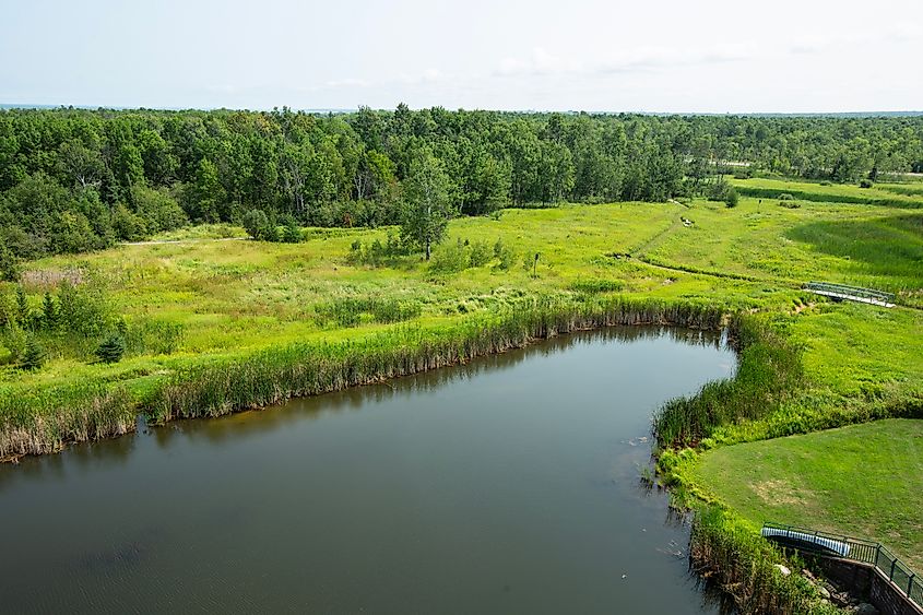 Scenic park with pond and walking trail in northern Wisconsin.