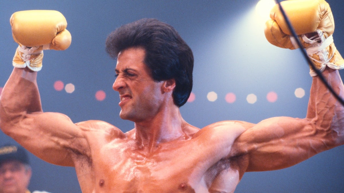 LOS ANGELES, CALIFORNIA - CIRCA 1982: Actor Sylvester Stallone, as Rocky Balboa, shows off his muscles in the boxing ring on the set of Rocky III in May of 1982 in Los Angeles, California. (Photo by James Drake/Getty Images)