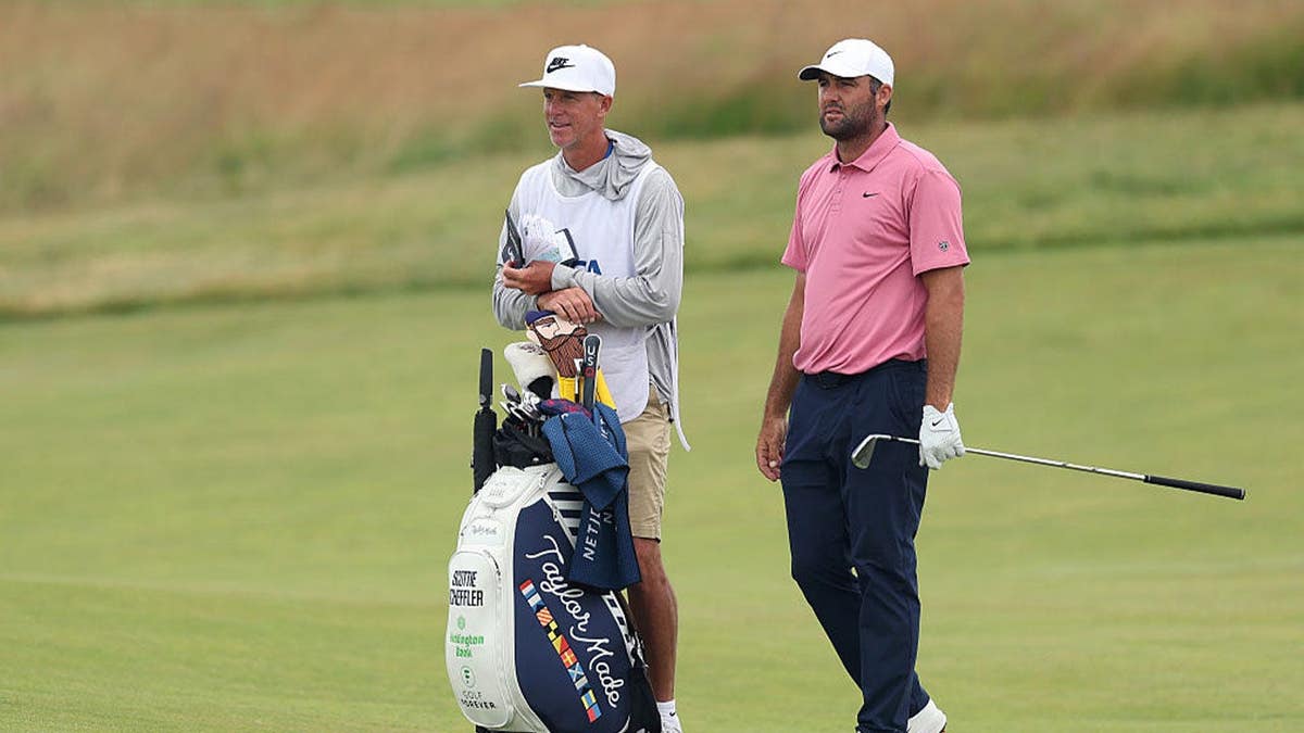 Scottie Scheffler of the United States and caddie Ted Scott