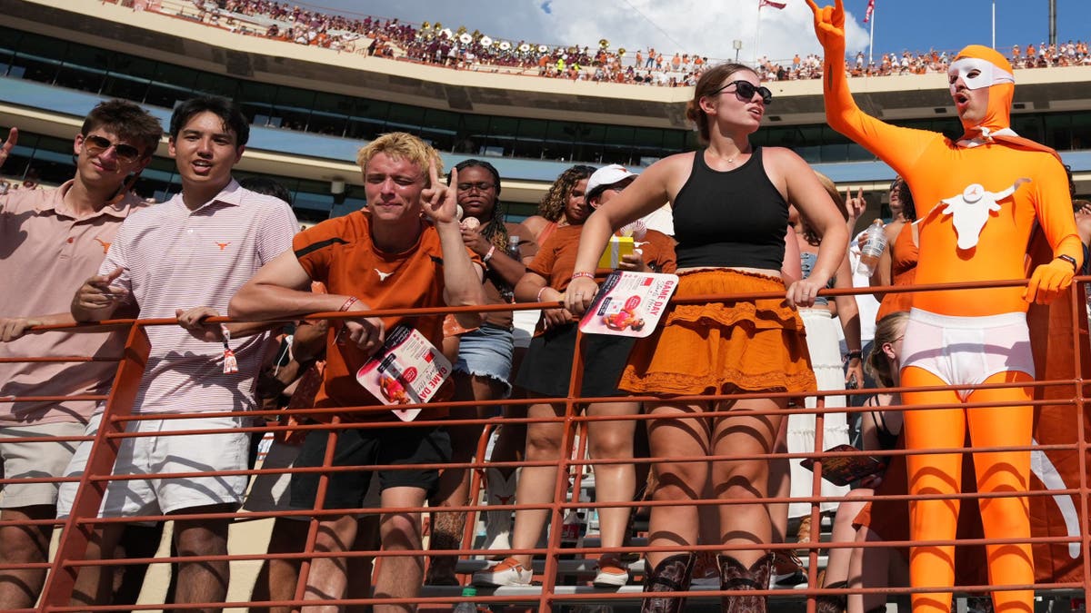 Texas Longhorns fans stand during the fourth quarter at Darrell K Royal-Texas Memorial Stadium.