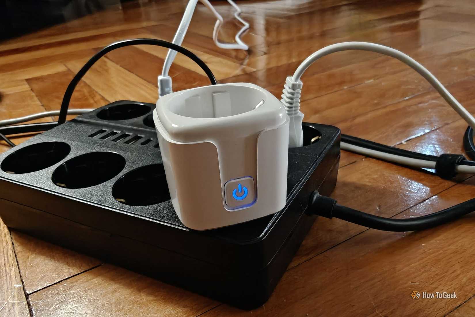 Smart plug plugged into a power strip.