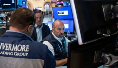 Stocks fall after a surprisingly strong jobs report raises prospects of an interest rate hike