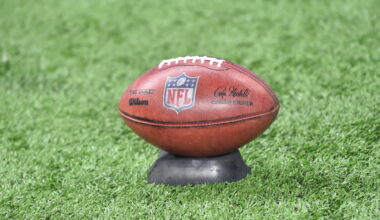 Rules permit 12th player to hold ball on kickoffs without tee, regardless of weather