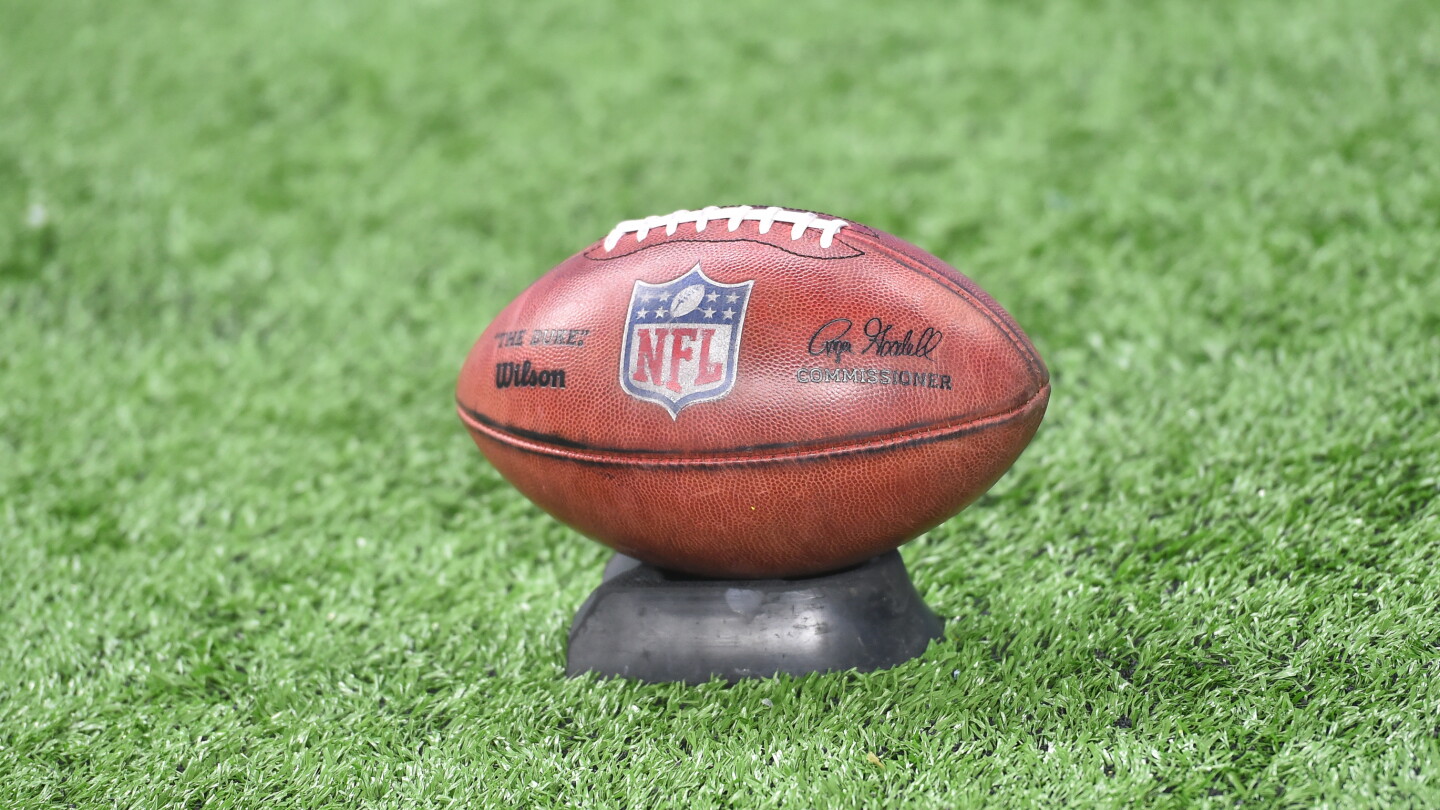 Rules permit 12th player to hold ball on kickoffs without tee, regardless of weather