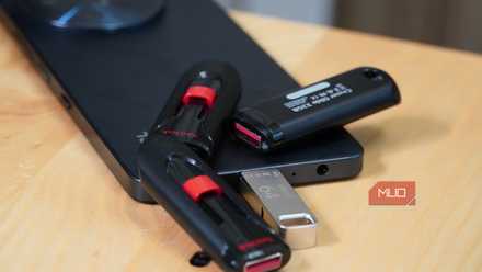 USB drives scattered around a smartphone.