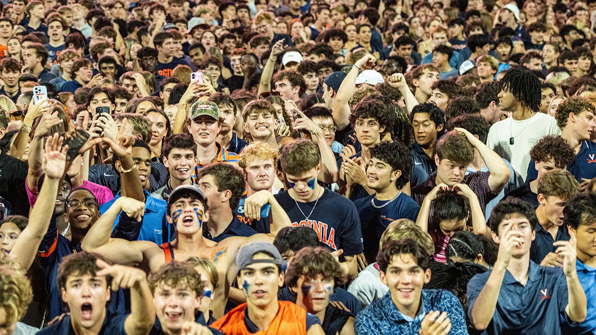 Fans in Virginia storm the field after overtime win over Florida State of an NCAA college football game, Friday, Sept. 26 2025, in Charlottesville, Virginia.