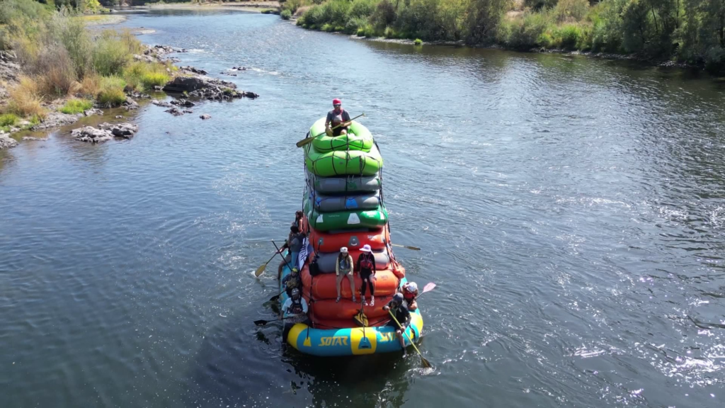 Local rafters navigate Rogue River on record-breaking ten-raft stack