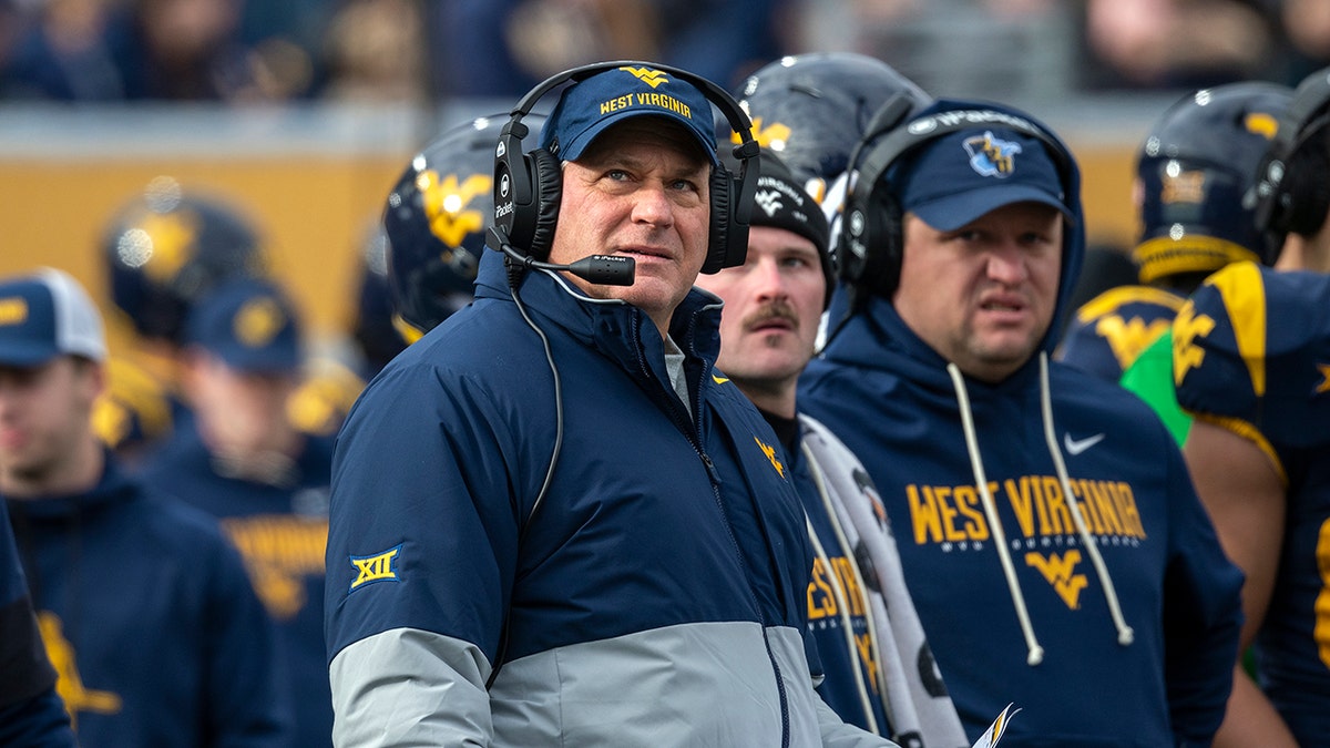 West Virginia football head coach Rich Rodriguez on field