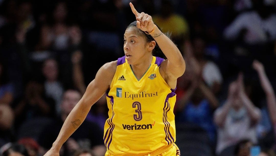 FILE - In this Aug. 4, 2017, file photo, Los Angeles Sparks' Candace Parker celebrates her basket against the New York Liberty during the second half of a WNBA basketball game in Los Angeles.
