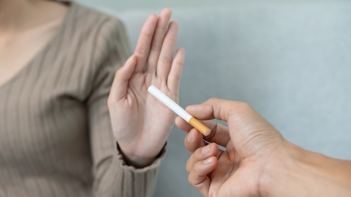 Woman refusing cigarette