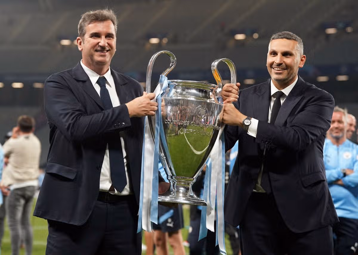 Manchester City chairman Khaldoon Al Mubarak (right) and CEO Ferran Soriano with the UEFA Champions League trophy