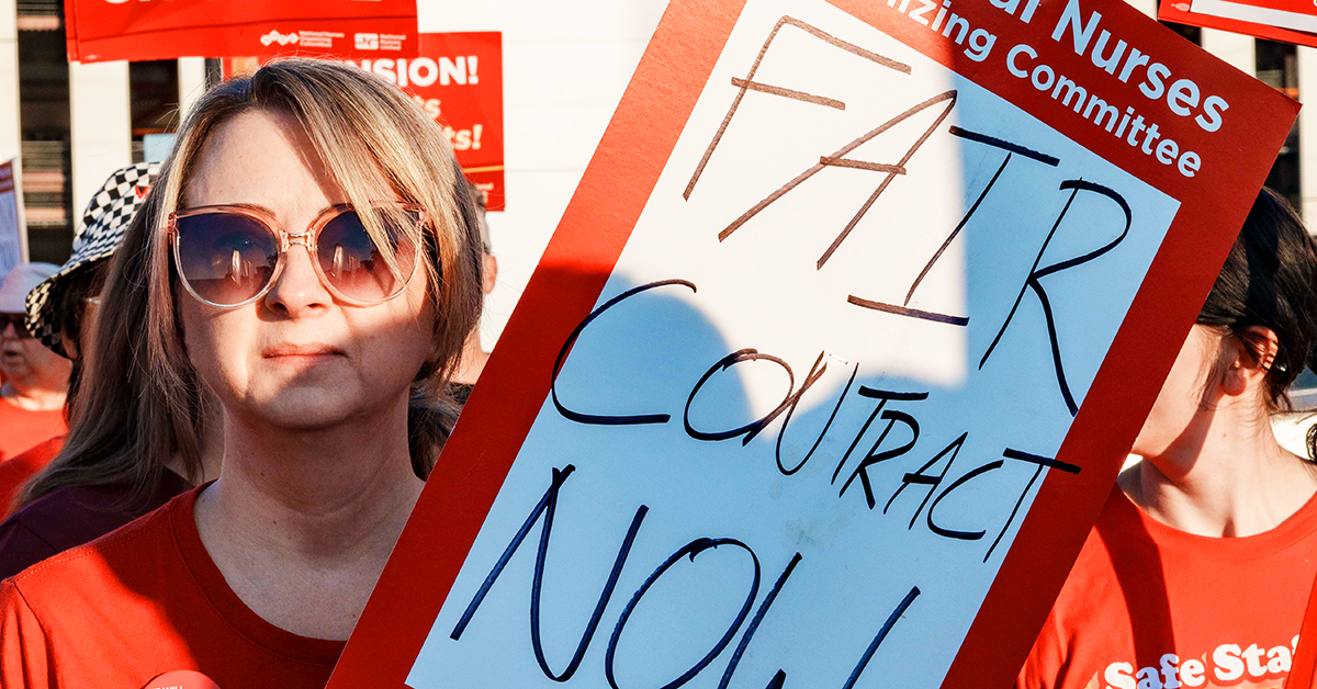 Wichita nurse holding sign "Fair contract now"