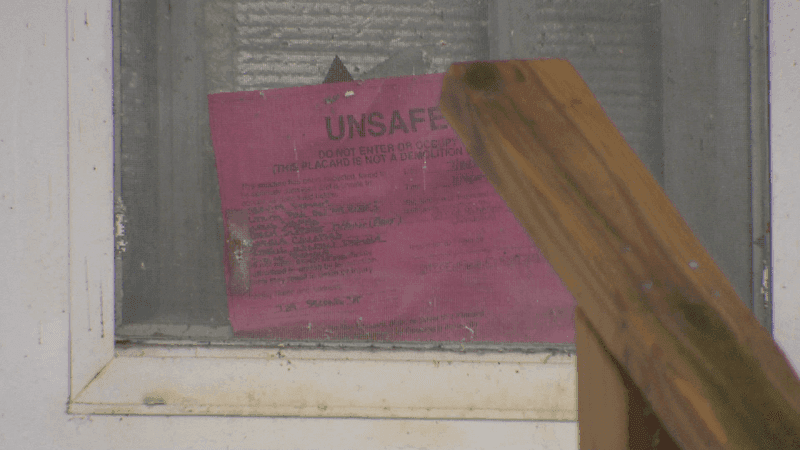 A note deeming a home in Menasha unsafe following tornado damage. October 15, 2026. (WLUK/Austin Roth)