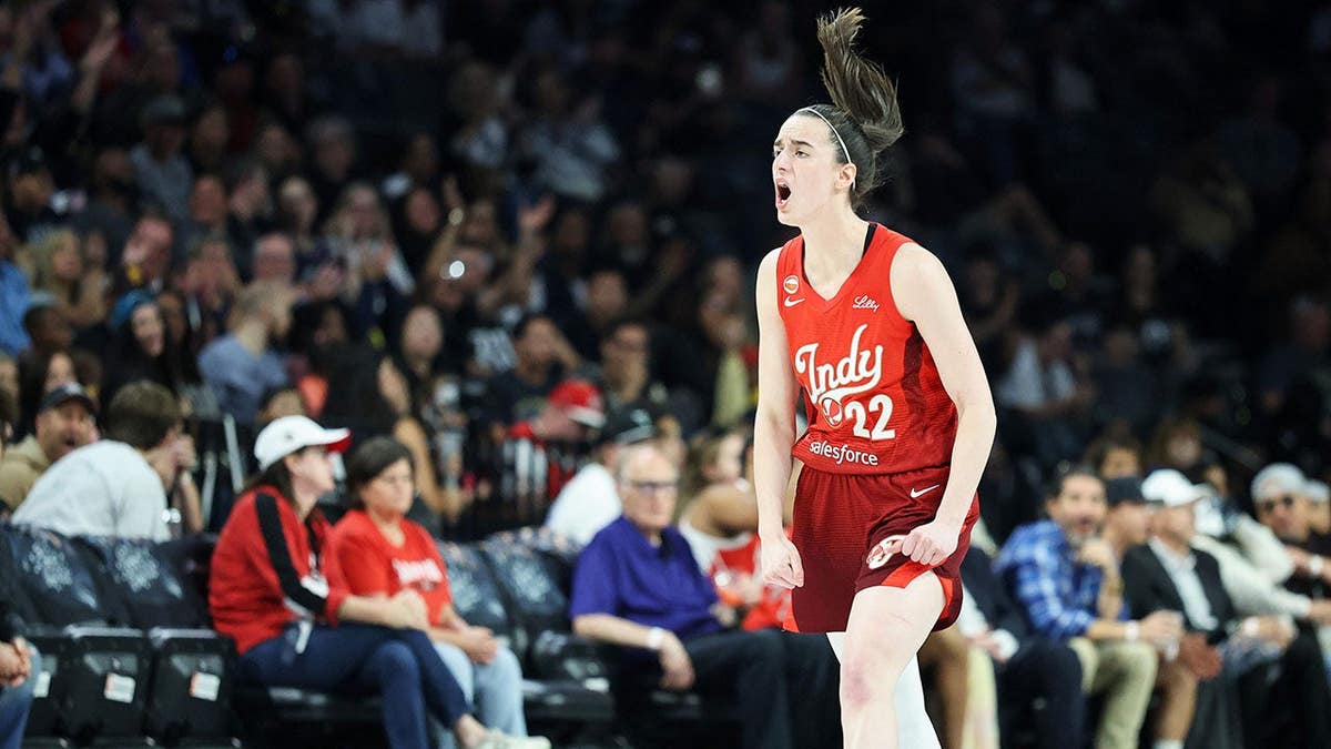 Caitlin Clark of the Indiana Fever reacts after hitting a 3-pointer against the Las Vegas Aces.