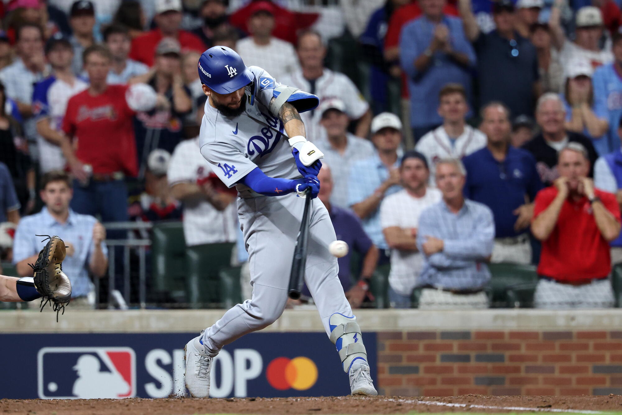 Dodger Andy Pages hits a two-RBI single against the Braves during Game 4 of the NLDS Wednesday in Atlanta.