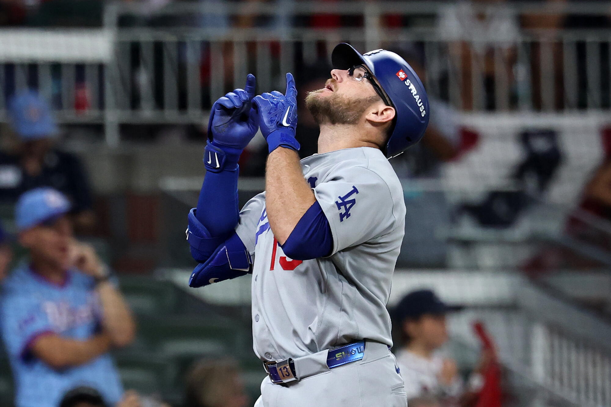 Dodger Max Muncy celebrates after hitting a home run in the ninth inning of Game 4 of the NLDS against the Braves.
