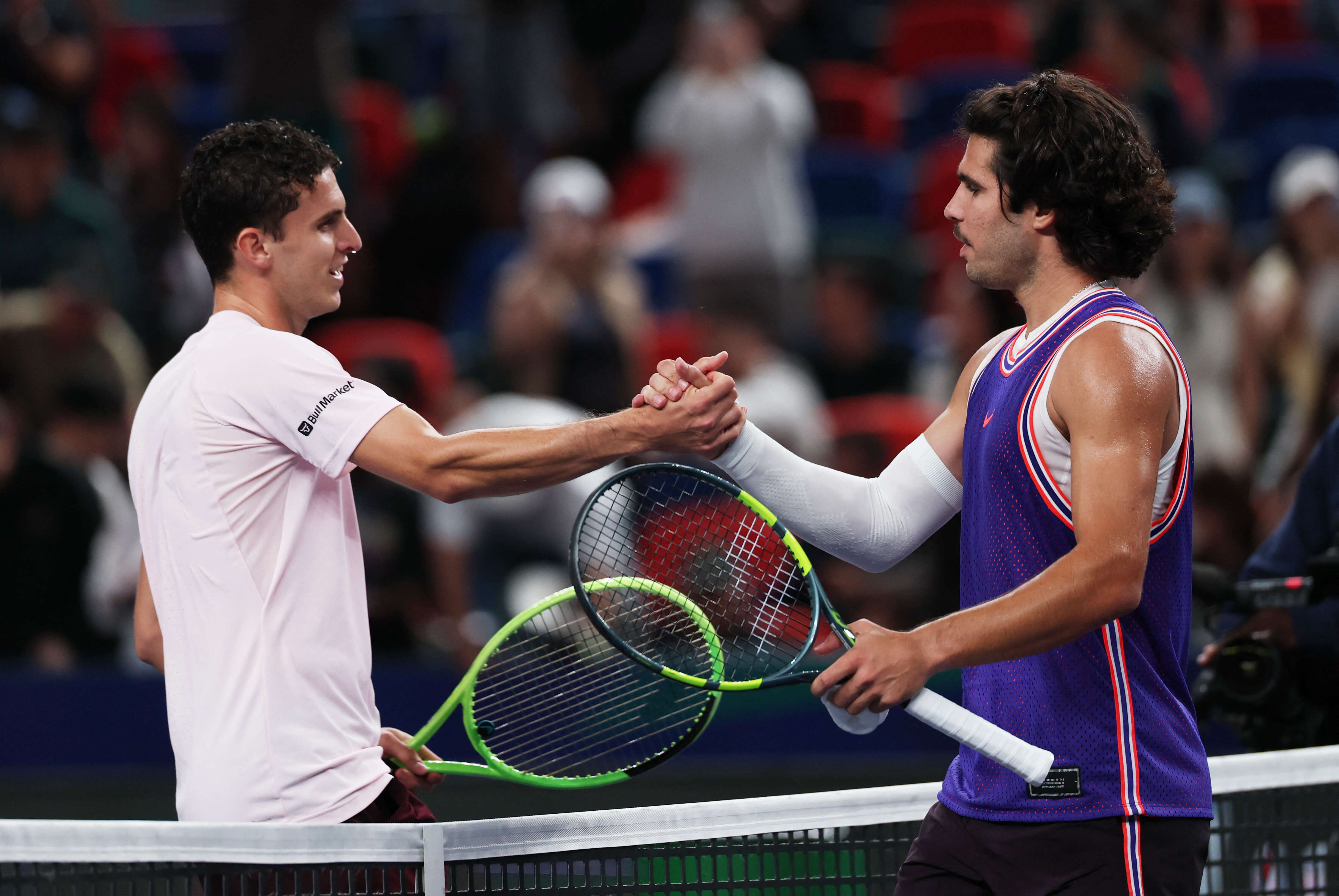 Tennis - ATP Masters 1000 - Shanghai Masters - Qizhong Forest Sports City Arena, Shanghai, China - October 10, 2026 Spain's Carlos Alcaraz shakes hands with Argentina's Juan Manuel Cerundolo after winning his round of 64 match REUTERS/Tyrone Siu ATP Masters 1000 - Shanghai Masters