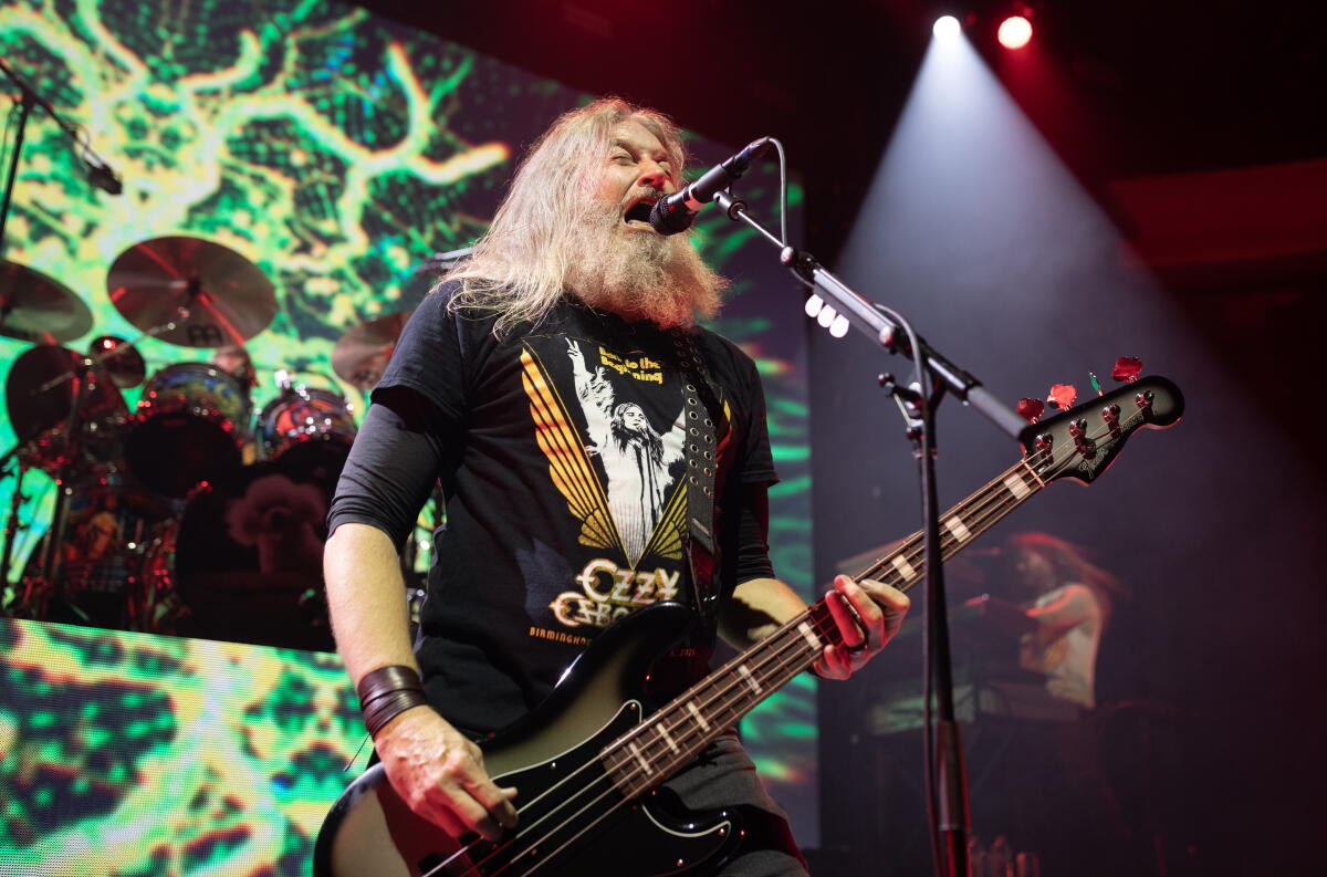 Mastodon singer-bassist Troy Sanders (center) performs at the Hollywood Palladium.
