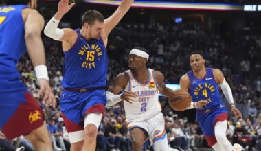 Oklahoma City Thunder guard Shai Gilgeous-Alexander, center, drives to the basket as Denver Nuggets center Nikola Jokic, left, and guard Russell Westbrook defend in the second half of Game 3 in the Western Conference semifinals of the NBA basketball playoffs Friday, May 9, 2025, in Denver. (AP Photo/David Zalubowski)