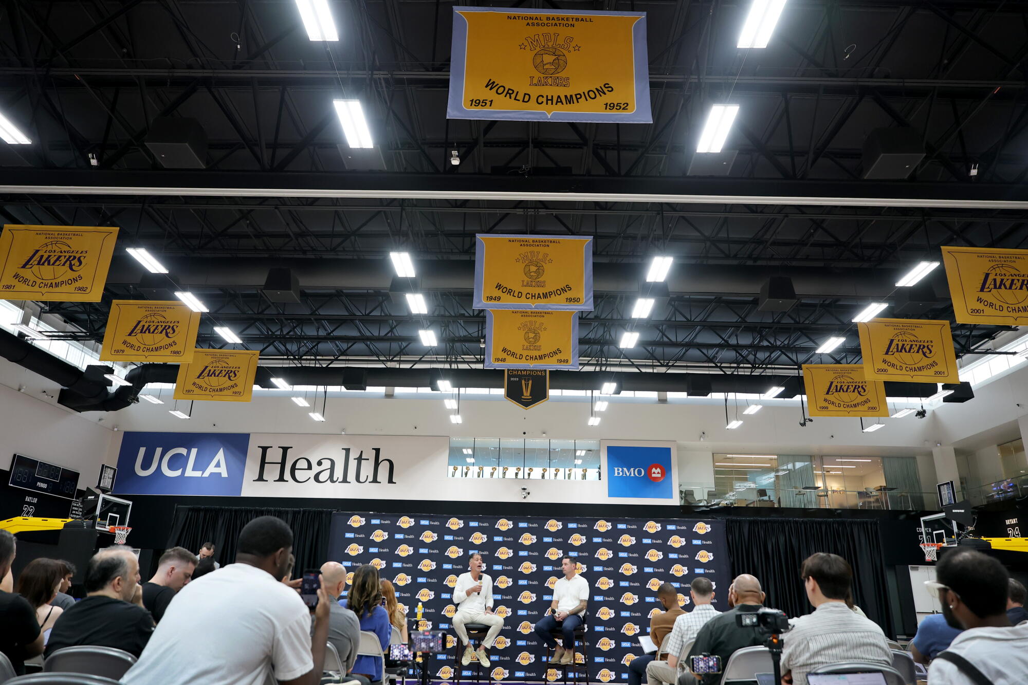 Lakers championship banners hang from the rafters and trophies are on display in an office overlooking the press conference
