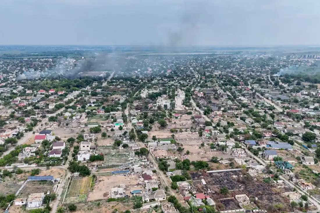 In this undated image from video provided by the Ukrainian 34th Separate Marine Brigade "Borysfen" on Sept. 22, 2026, smoke rises from a residential neighborhood in the Russian-occupied city of Oleshky in the Kherson region of Ukraine.