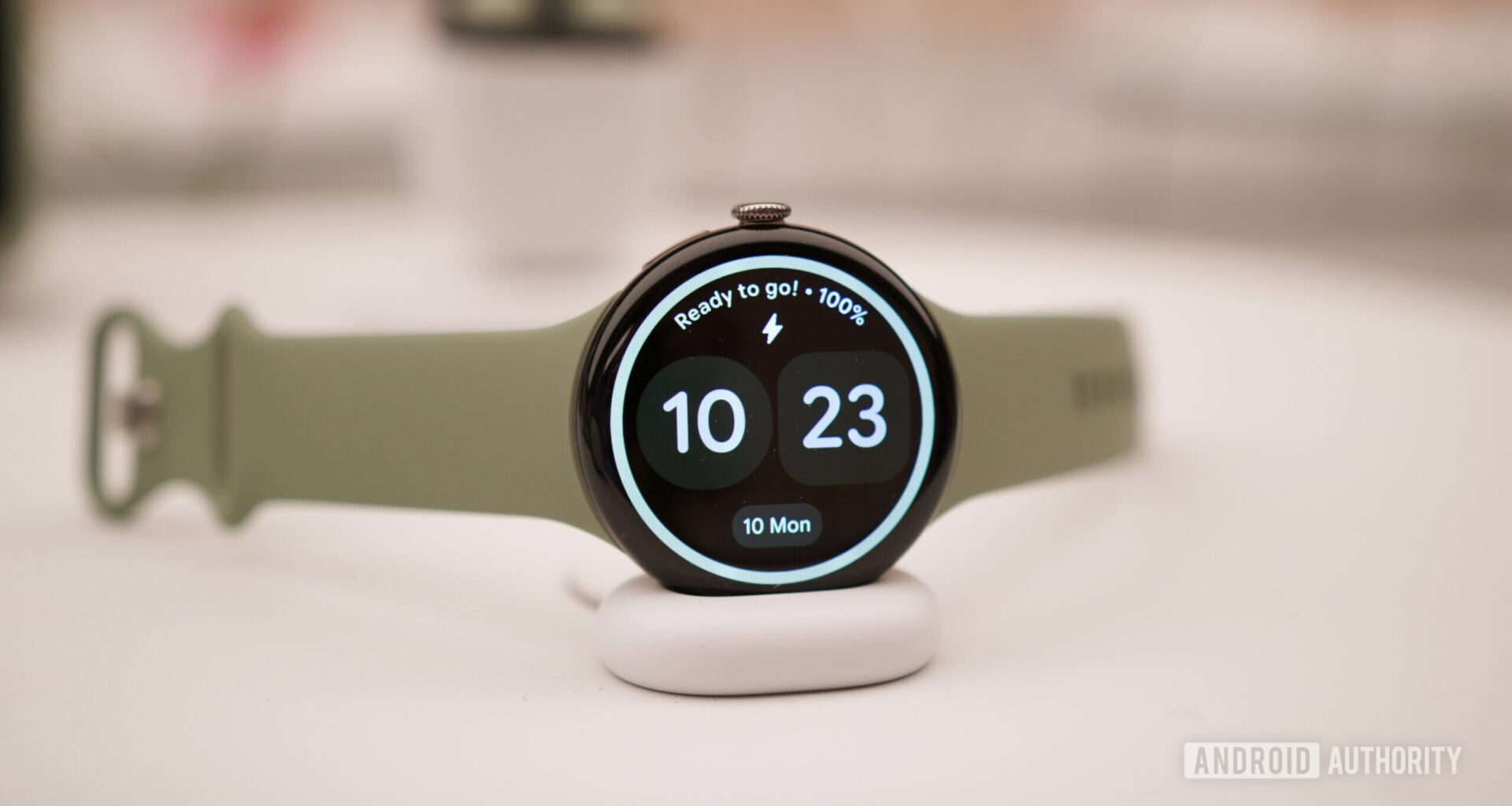 Google Pixel Watch 5 on its charging dock.
