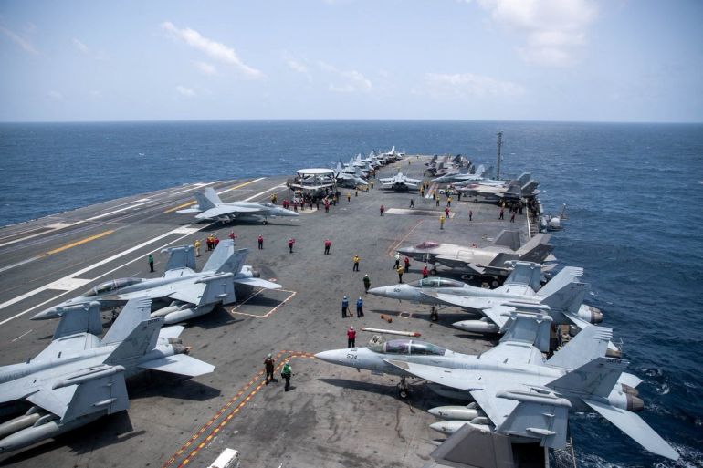 U.S. Navy sailors work on the flight deck of the aircraft carrier USS George Washington as it transits the Arabian Sea to support U.S. military operations in the war with Iran August 20, 2026. U.S. Navy/Handout via REUTERS THIS IMAGE HAS BEEN SUPPLIED BY A THIRD PARTY