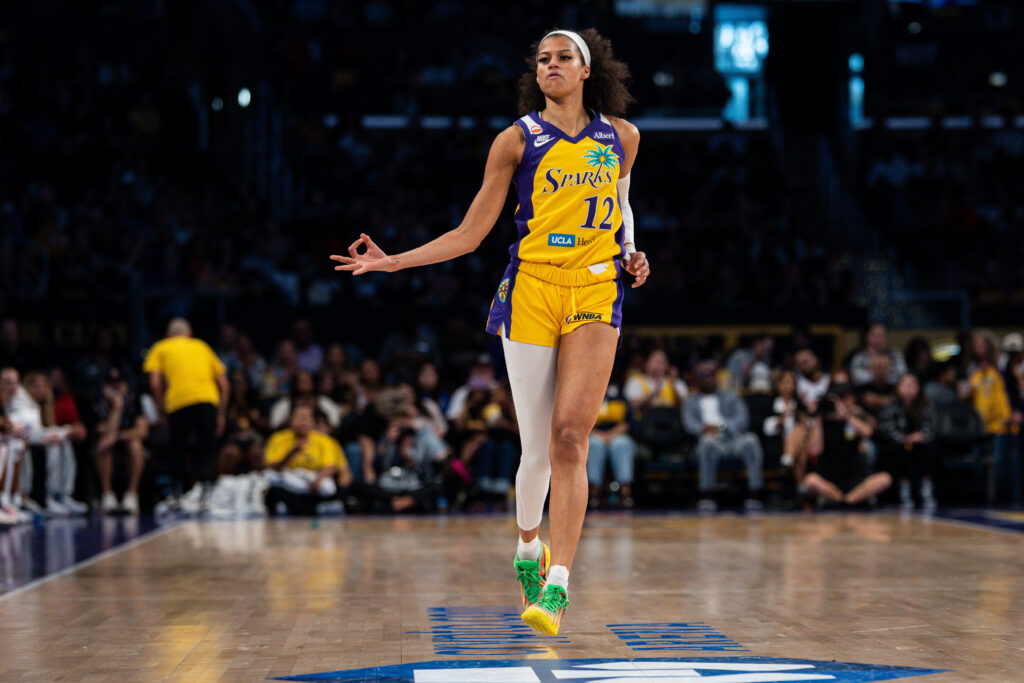 Los Angeles Sparks guard Rae Burrell (12) celebrates after making a three pointer in the second quarter against the Portland Fire at Crypto.com Arena.