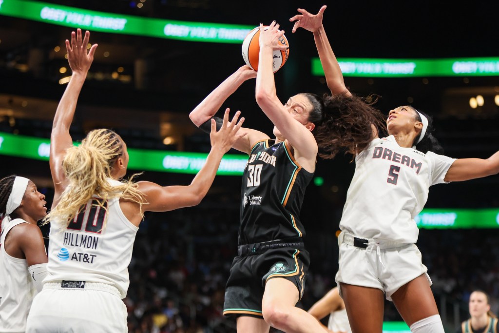 Breanna Stewart shoots the ball while <a rel=