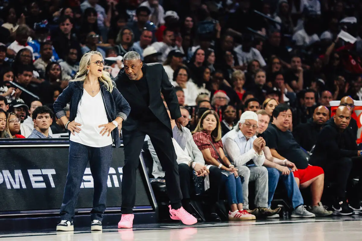 Aces head coach Becky Hammon is advised by assistant coach Larry Lewis during game three of a W ...