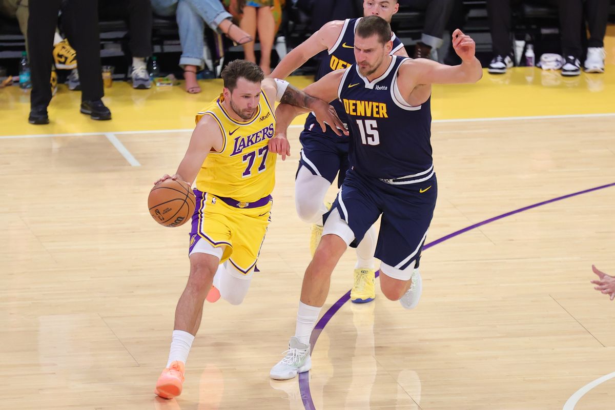 Los Angeles Lakers PG Luka Doncic (77) drives the lane against Denver Nuggets C Nikola Jokic (15) during an NBA basketball game, Friday October 16, 2026 in Los Angeles, Calif. Los Angeles Lakers PG Luka Doncic (77) drives the lane against Denver Nuggets C Nikola Jokic (15) during an NBA basketball game, Friday October 16, 2026 in Los Angeles, Calif.