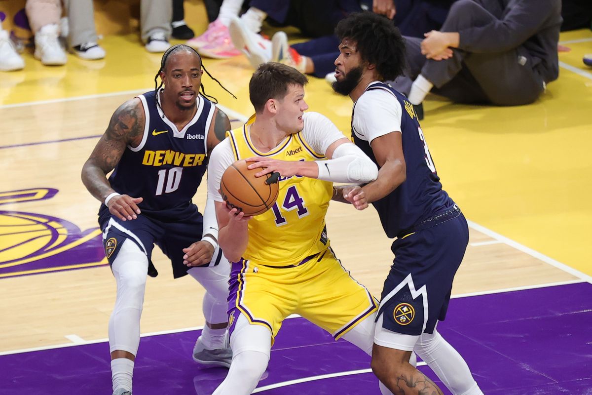 Los Angeles Lakers C Walker Kessler (14) battles in the post during an NBA basketball game against the Denver Nuggets, Friday October 16, 2026 in Los Angeles, Calif. Los Angeles Lakers C Walker Kessler (14) battles in the post during an NBA basketball game against the Denver Nuggets, Friday October 16, 2026 in Los Angeles, Calif.