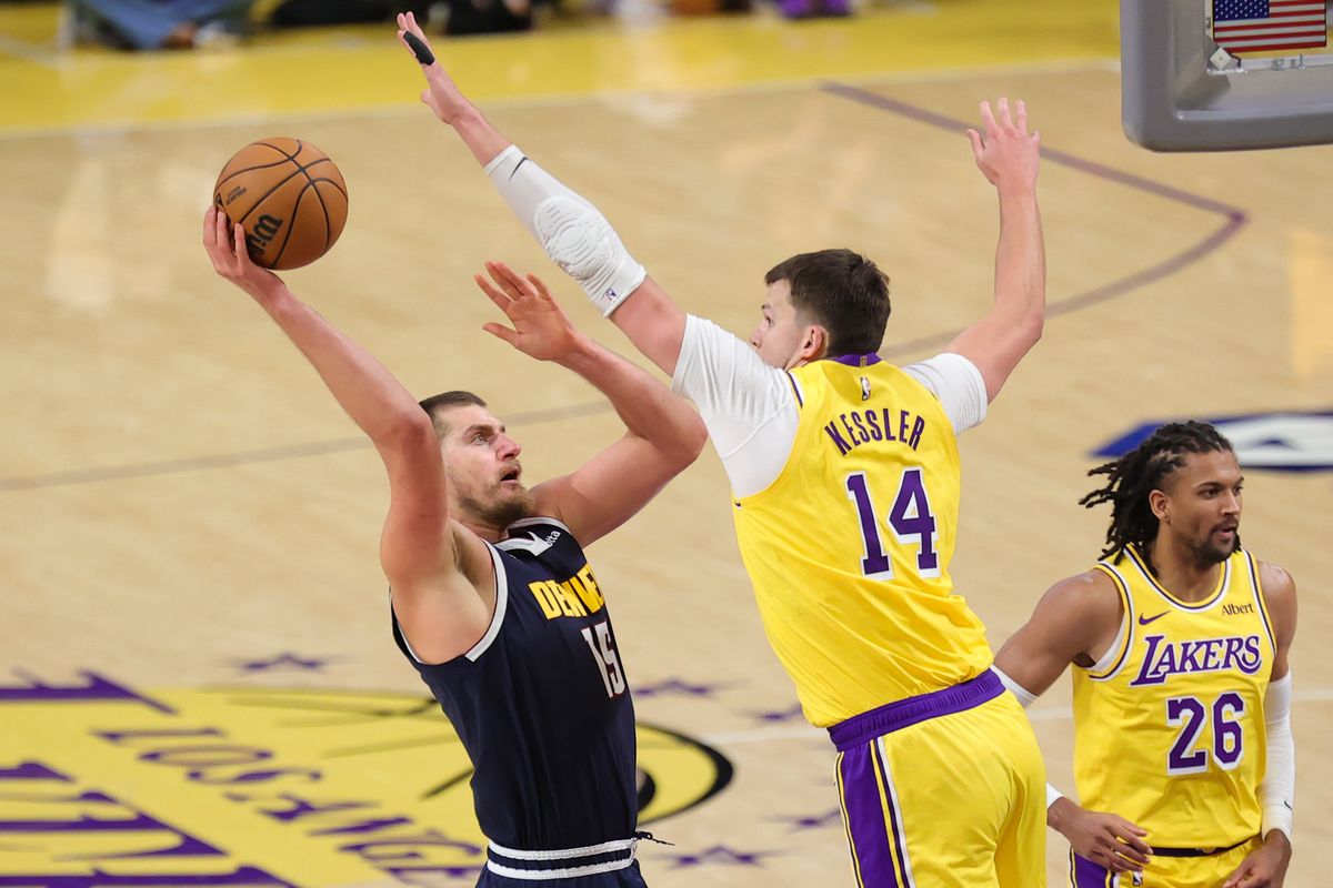 Los Angeles Lakers C Walker Kessler (15) defends against Denver Nuggets C Nikola Jokic (15) during an NBA basketball game, Friday October 16, 2026 in Los Angeles, Calif. Los Angeles Lakers C Walker Kessler (15) defends against Denver Nuggets C Nikola Jokic (15) during an NBA basketball game, Friday October 16, 2026 in Los Angeles, Calif.