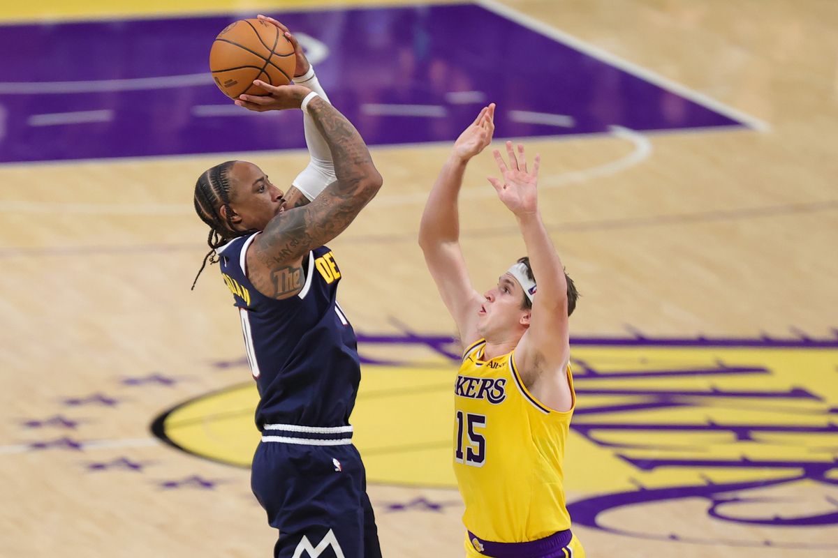Los Angeles Lakers G Austin Reaves (15) defends against Denver Nuggets G Demar Derozan (10) during an NBA basketball game, Friday October 16, 2026 in Los Angeles, Calif. Los Angeles Lakers G Austin Reaves (15) defends against Denver Nuggets G Demar Derozan (10) during an NBA basketball game, Friday October 16, 2026 in Los Angeles, Calif.