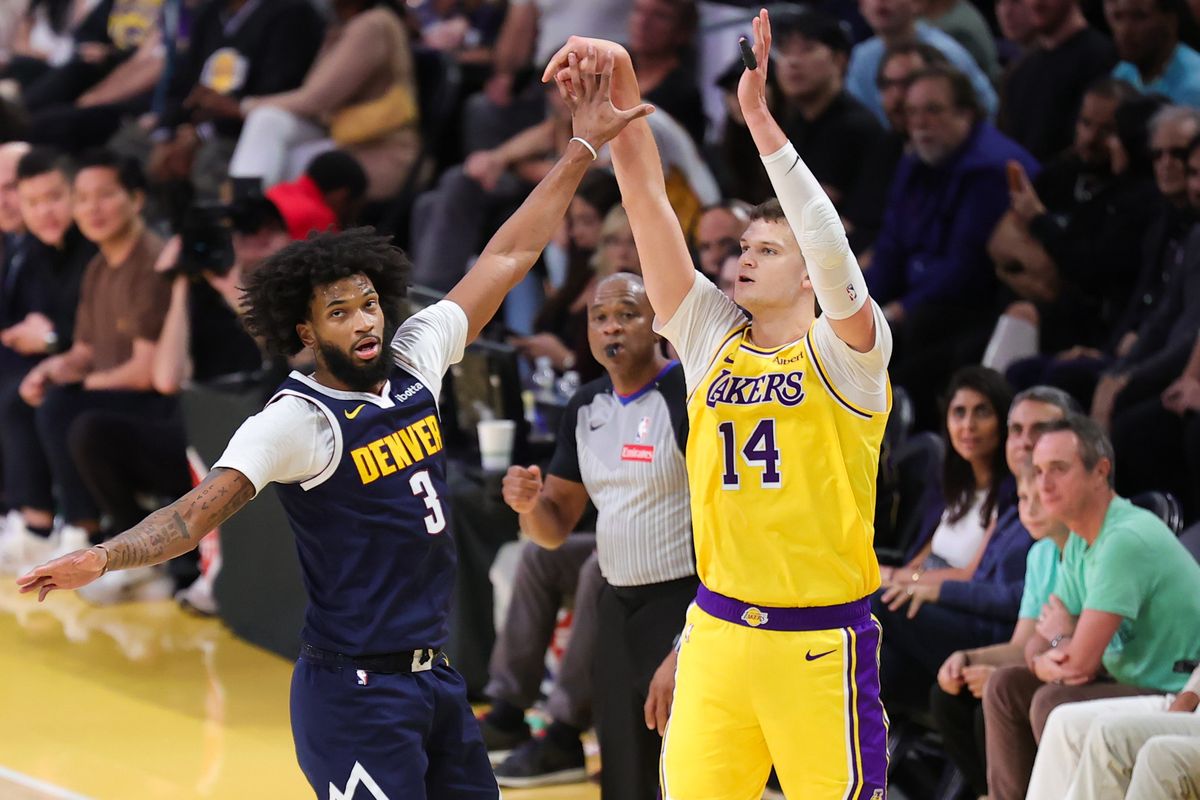 Los Angeles Lakers C Walker Kessler (14) shoots a jumpshot during an NBA basketball game against the Denver Nuggets, Friday October 16, 2026 in Los Angeles, Calif. Los Angeles Lakers C Walker Kessler (14) shoots a jumpshot during an NBA basketball game against the Denver Nuggets, Friday October 16, 2026 in Los Angeles, Calif.