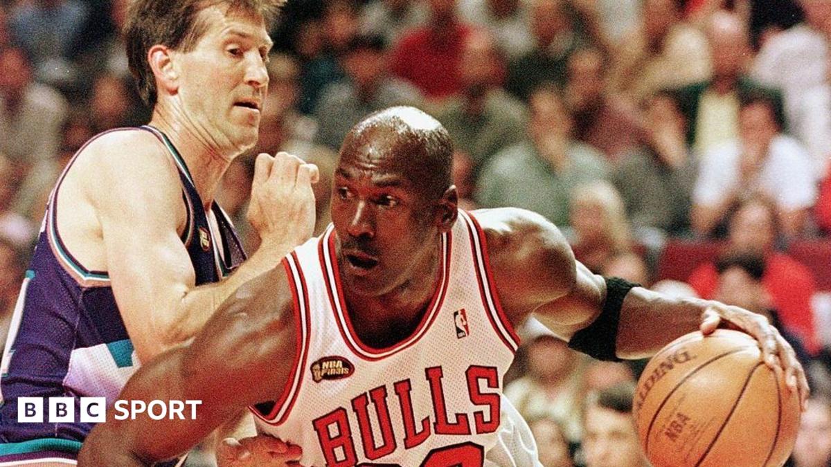 Michael Jordan of the Chicago Bulls goes to the basket past Jeff Hornacek of the Utah Jazz during game three of the 1998 NBA Finals