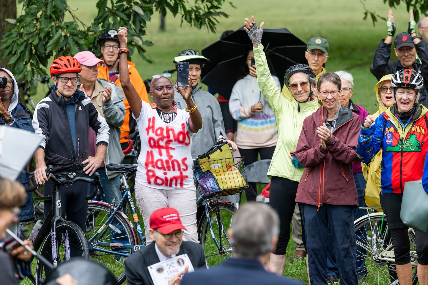  People cheered as former Olympian David Hearn joined the protest against Trump's redevelopment of East Potomac Golf Links at Hains Point on Oct. 4 in Washington, D.C. 