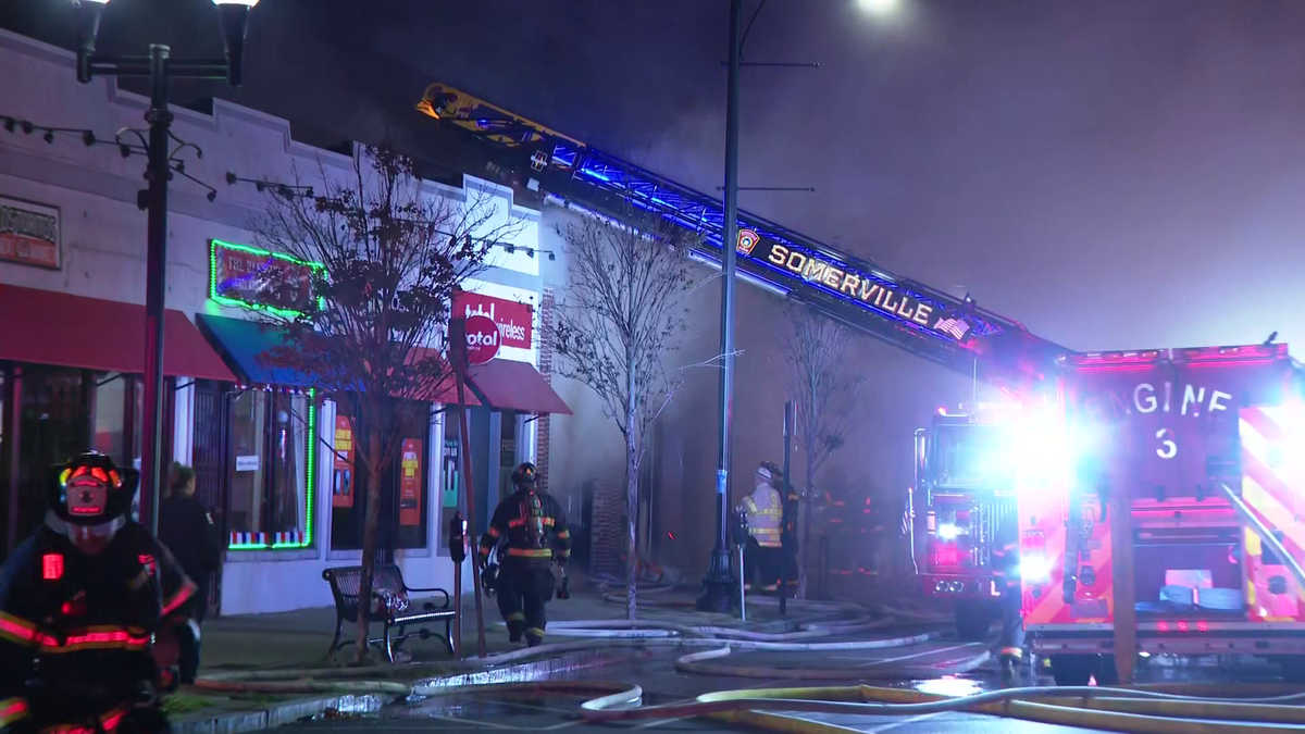 Crews battle a 5-alarm fire at a Somerville building