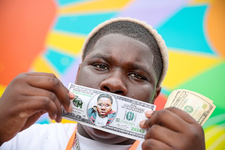 Zayvion Hamiel aka ZayMoney poses for a portrait after performing at the Africatown Diaspora Festival in Southwest Philadelphia on June 28.