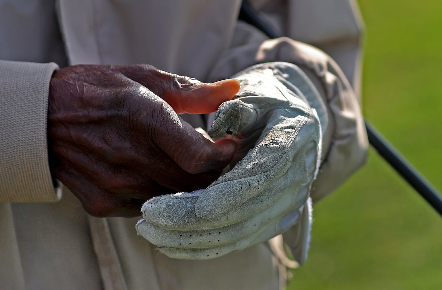George Jones, 94, adjusted his golf glove while playing golf at Franklin Park. 