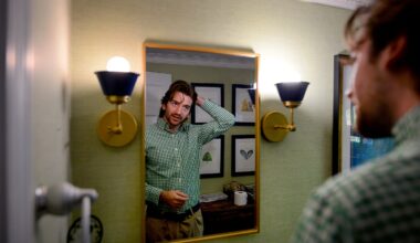 Taite Panton, 21, is a PANS/PANDAS patient who receives IVIG infusion treatments at his home in Duxbury. Taite combed his hair after he warmed up his arm so a vein could be easily found for his treatment.