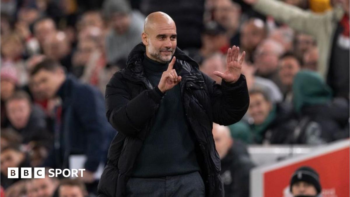 Manchester City manager Pep Guardiola holds up six fingers to indicate the six premier league titles he has won after Liverpool fans sing 'You're Getting Sacked it in Morning'