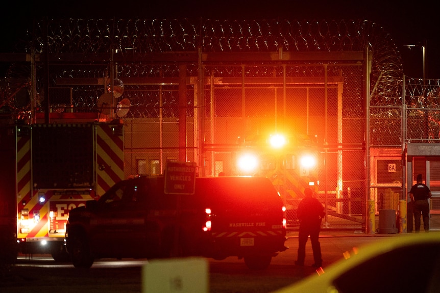 ambulances and lights outside a prison gate 