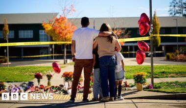 Oregon teacher fought school attacker before armed dad killed suspect - BBC