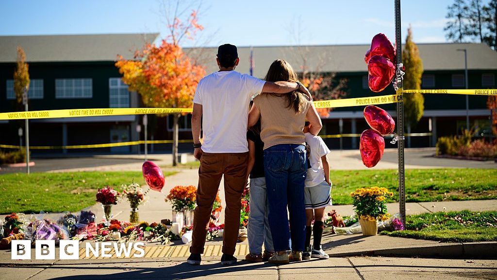Oregon teacher fought school attacker before armed dad killed suspect - BBC