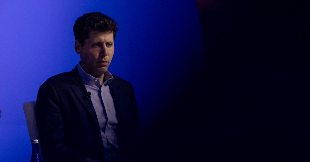 Sam Altman, CEO of OpenAI, looks offscreen with a blue background.